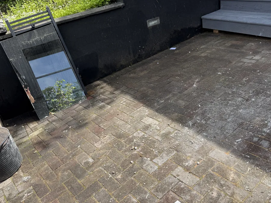 Paved patio surface before exterior cleaning.